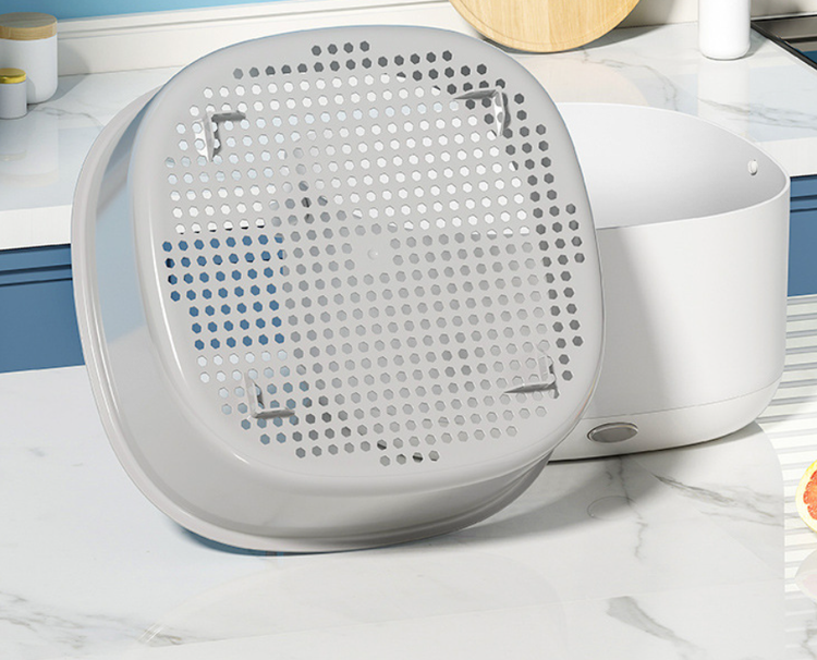 Portable Bucciato fruit and vegetable washing machine with transparent basin and control buttons for household use.