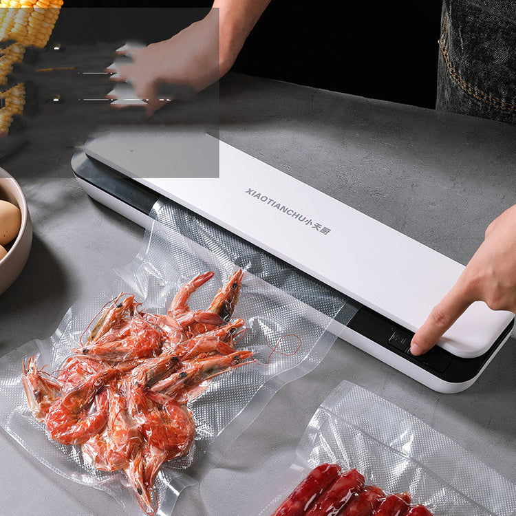 Small Bucciato household vacuum packaging machine with compact design and control panel for food preservation.