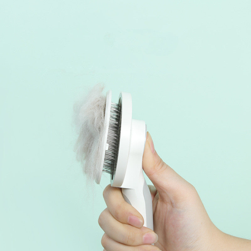 Bucciato pet massage comb with round handle for gentle grooming and deshedding of dogs and cats.
