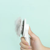 Bucciato pet massage comb with round handle for gentle grooming and deshedding of dogs and cats.