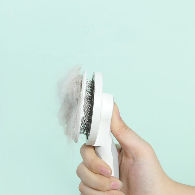 Bucciato pet massage comb with round handle for gentle grooming and deshedding of dogs and cats.