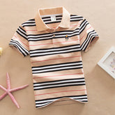 Boy wearing a navy college style polo short sleeve T-shirt with a collar and button placket, made by Bucciato.