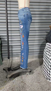 High-elasticity embroidered flared jeans for women, designer denim by Bucciato, showcasing detailed embroidery and stylish fit.