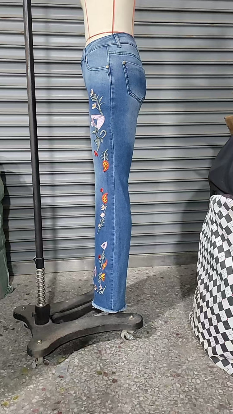 High-elasticity embroidered flared jeans for women, designer denim by Bucciato, showcasing detailed embroidery and stylish fit.