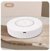 Rechargeable magnetic coffee stirring coaster from Bucciato, a smart kitchen gadget for automatic beverage stirring.