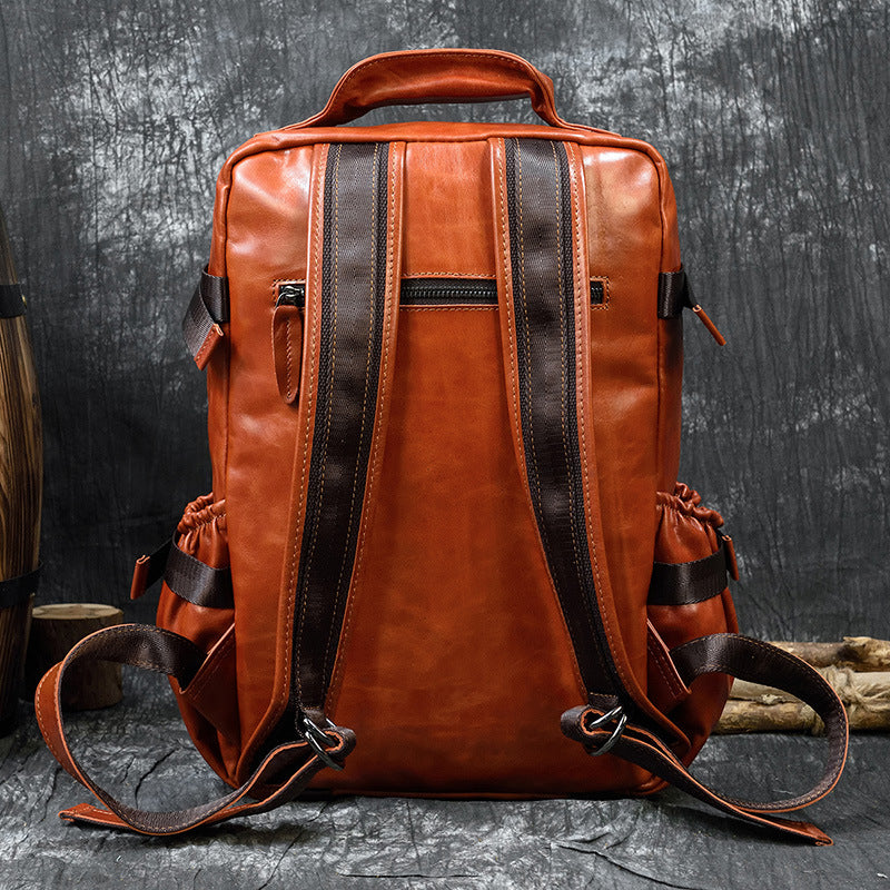 Large capacity cowhide shoulder computer bag with flip design, crafted by Bucciato Multi-Product Store, featuring multiple compartments.
