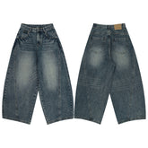Vintage blue washed tie-dye bootcut jeans from Bucciato, showcasing distressed fabric and classic fit on a mannequin.