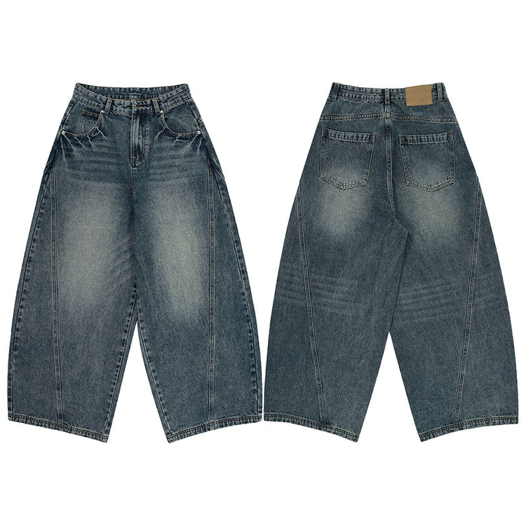 Vintage blue washed tie-dye bootcut jeans from Bucciato, showcasing distressed fabric and classic fit on a mannequin.