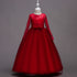 Long flower girl dress for kids by Bucciato, featuring floral details and a flowing design for special occasions.
