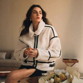 Womens thickened lamb-mohair leather and fur all-in-one biker jacket with a stylish, rugged design and fur accents.