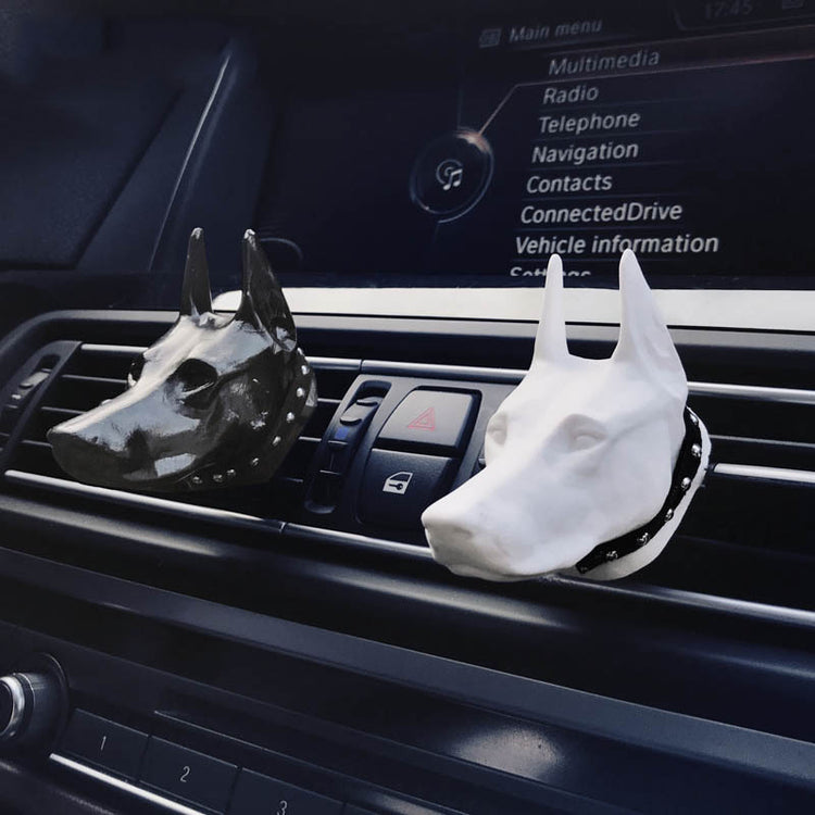 Doberman-shaped car air freshener clip by Bucciato, a creative interior accessory for freshening car air outlets.