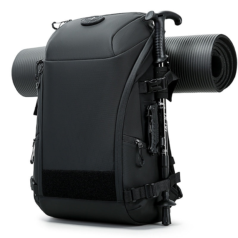 High-capacity multi-functional outdoor adventure backpack in black with multiple compartments and adjustable straps.