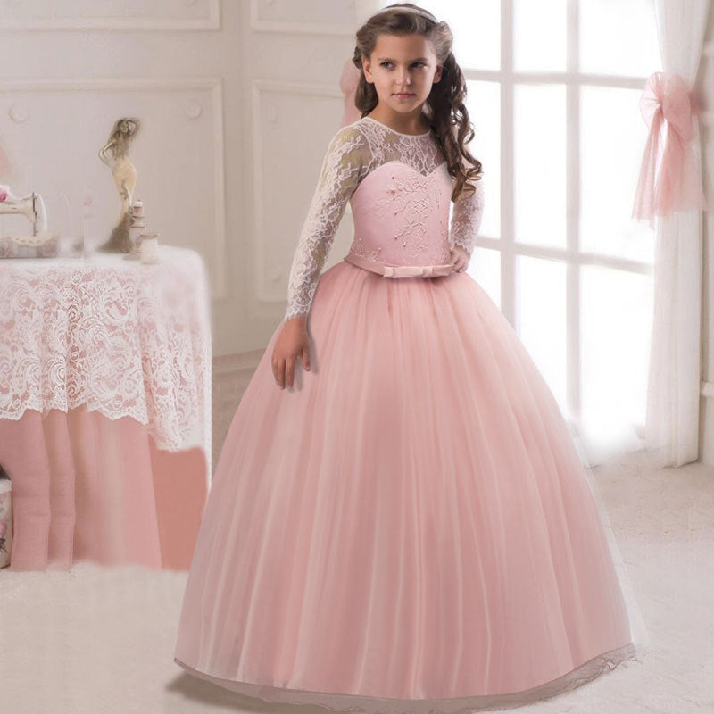 Long flower girl dress for kids by Bucciato, featuring floral patterns and delicate fabric, perfect for special occasions.
