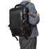 Large cowhide flip shoulder computer bag in brown with multiple compartments, designed for high capacity and stylish carrying.