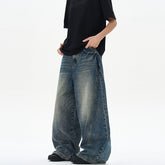 American-style vintage blue washed tie-dye bootcut jeans with a relaxed fit and faded wash, displayed on a hanger.