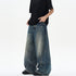 American-style vintage blue washed tie-dye bootcut jeans with a relaxed fit and faded wash, displayed on a hanger.