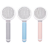 Round handle pet massage comb with stainless steel teeth for gentle grooming and de-shedding of dogs and cats.