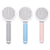 Round handle pet massage comb with stainless steel teeth for gentle grooming and de-shedding of dogs and cats.