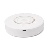 Rechargeable magnetic coffee stirrer coaster from Bucciato, a smart kitchen gadget for automatic beverage stirring.