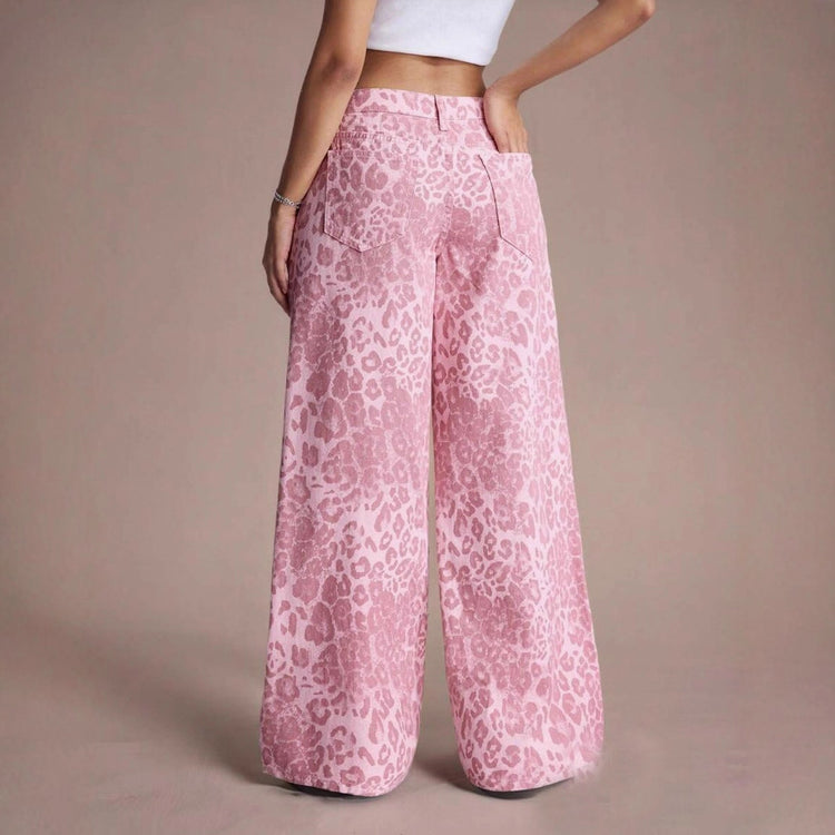 Female loose fit straight wide-leg denim jeans in light blue, styled with casual top and sneakers for a relaxed look.