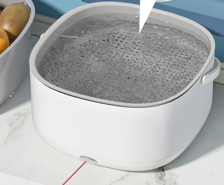 Portable Bucciato fruit and vegetable washing machine for household use, compact design with multiple cleaning functions.