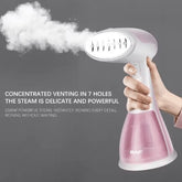 Portable Bucciato garment steamer with hand-hanging design, compact and easy to use for quick clothing steaming.