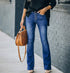 Women’s high-waist bell bottom jeans in washed denim, flared street style pants from Bucciato for trendy casual wear.