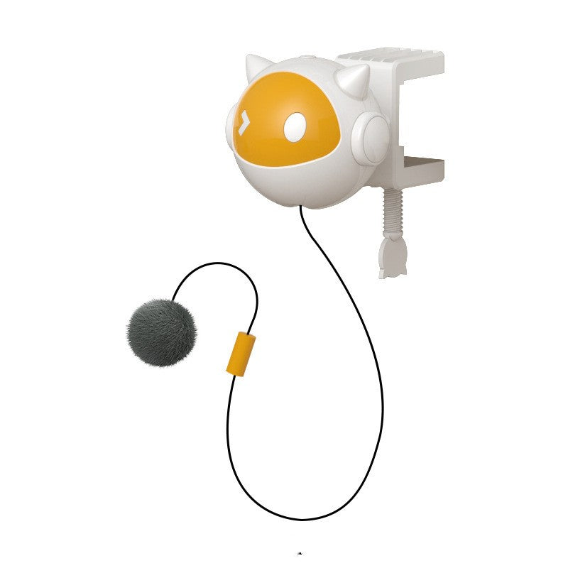 Lifting Electric Cat Toy in white plastic with a yellow face panel, clamp mount, black cord and gray pom-pom lure